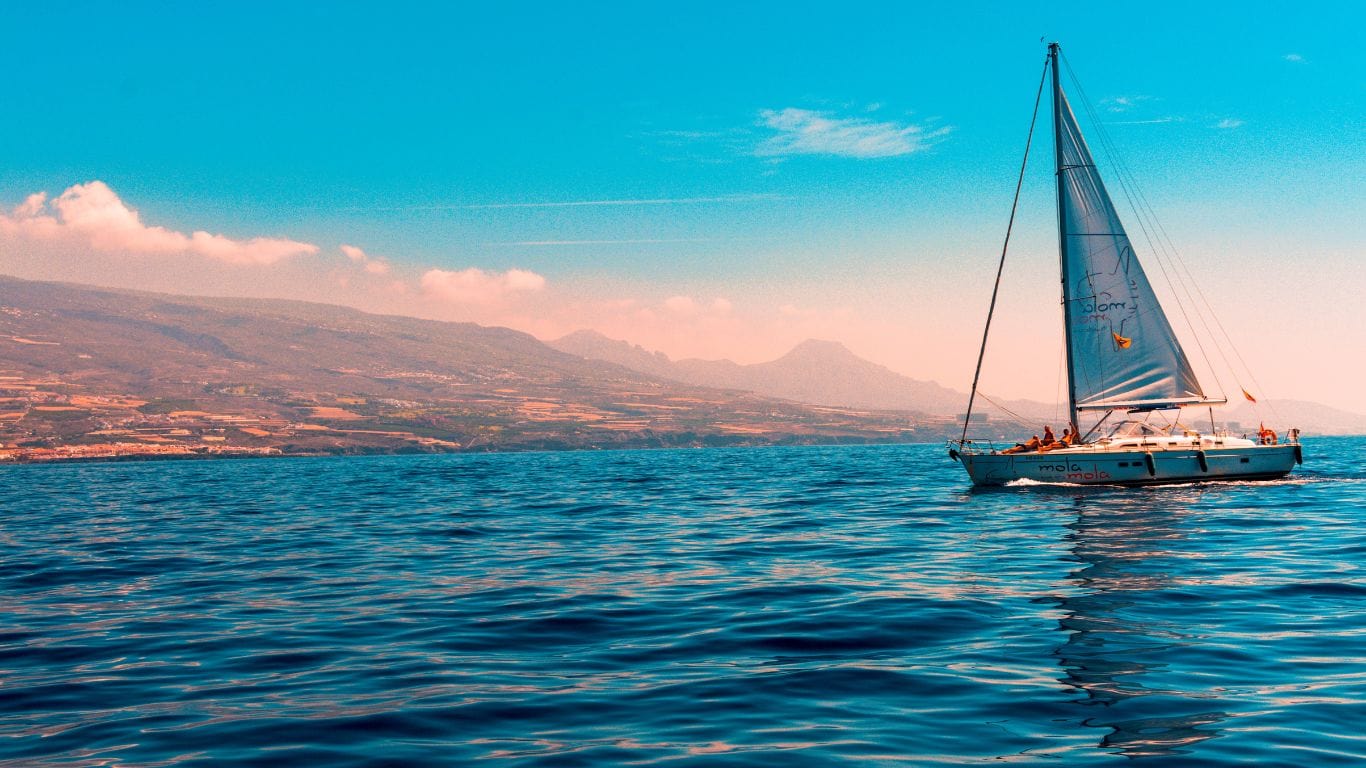 A picture of people sailing on a yacht.