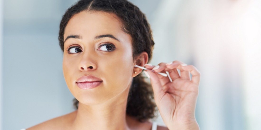 A woman with ear stick